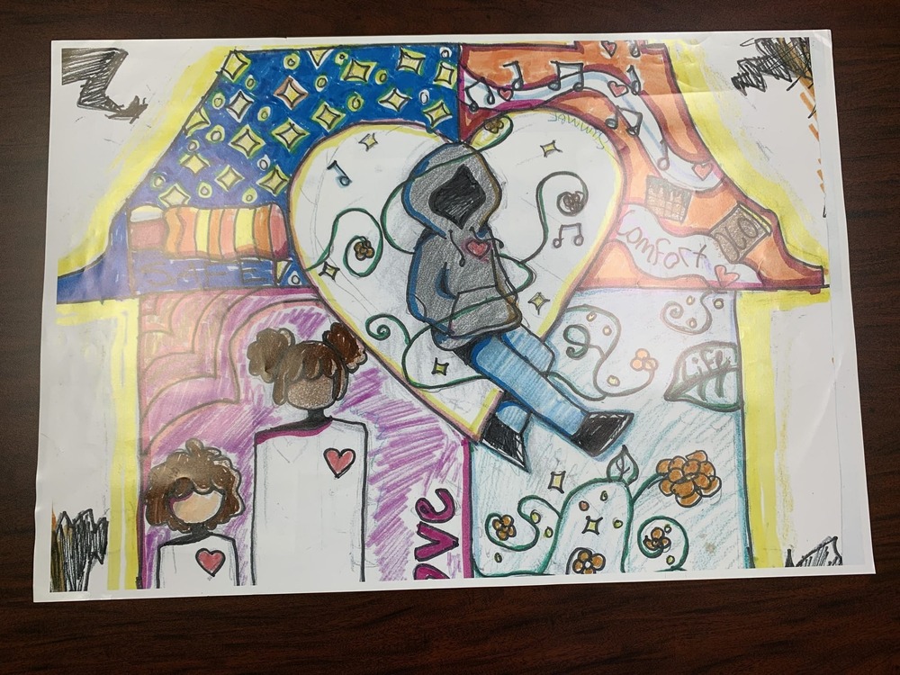 October winning drawing features a person wearing a hoodie surrounded by music notes and other things in their home.  